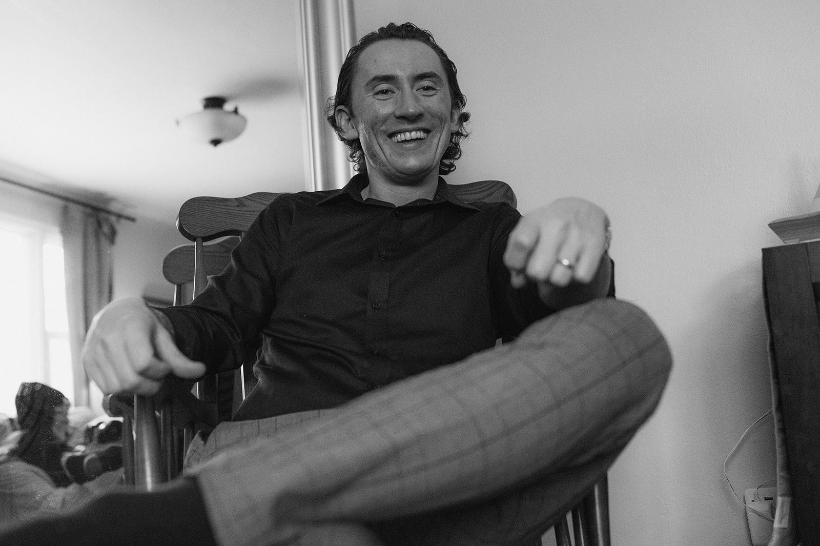 Black and white portrait of Russell smiling